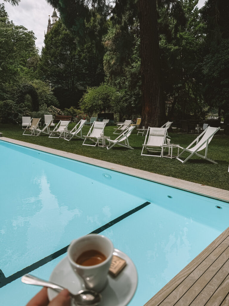 the beautiful outdoor pool in the park of the hotel in the city center