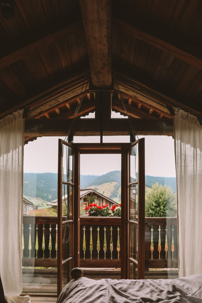 Elegant lounge area with panoramic windows at the Luxury Lakeside Chalet Priesteregg